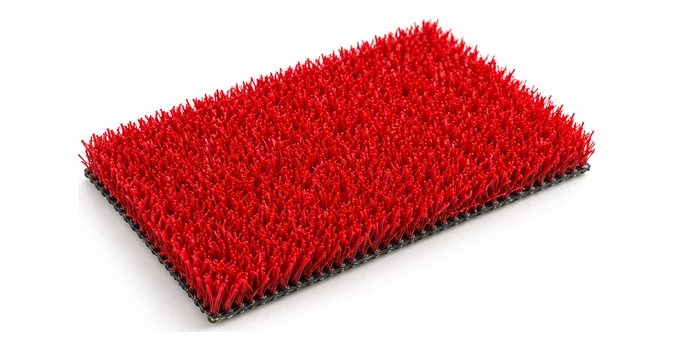 Muestra rectangular de césped artificial rojo sobre fondo blanco